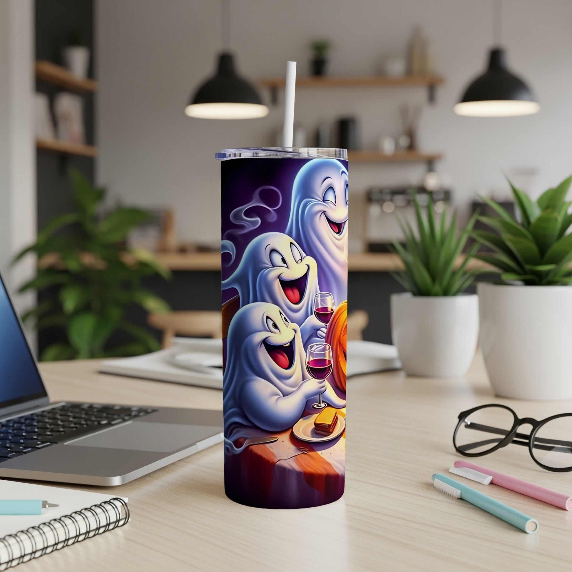 Tumbler featuring three cheerful ghosts holding wine glasses and a slice of cake.