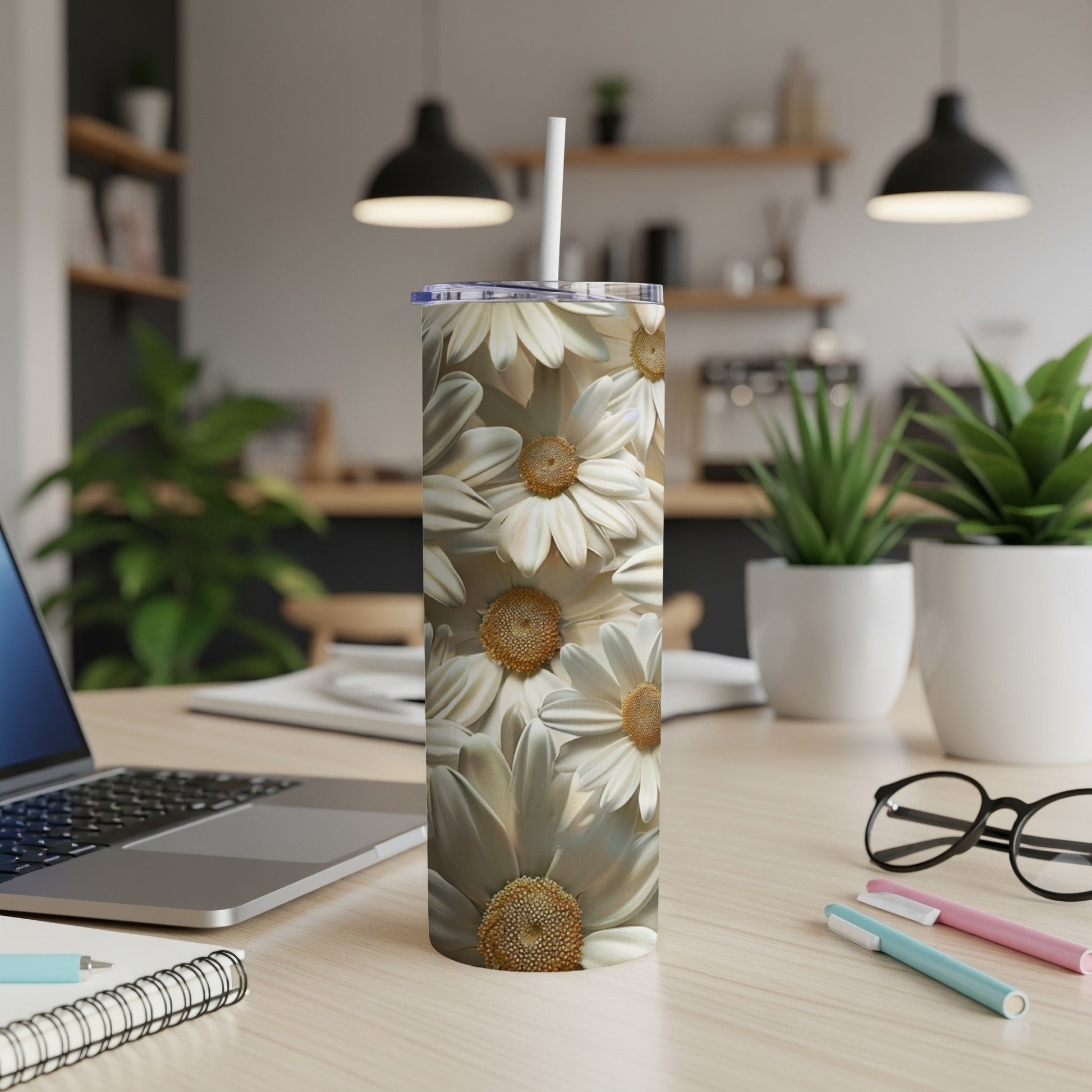 White daisies pattern on a white tumbler with a straw.