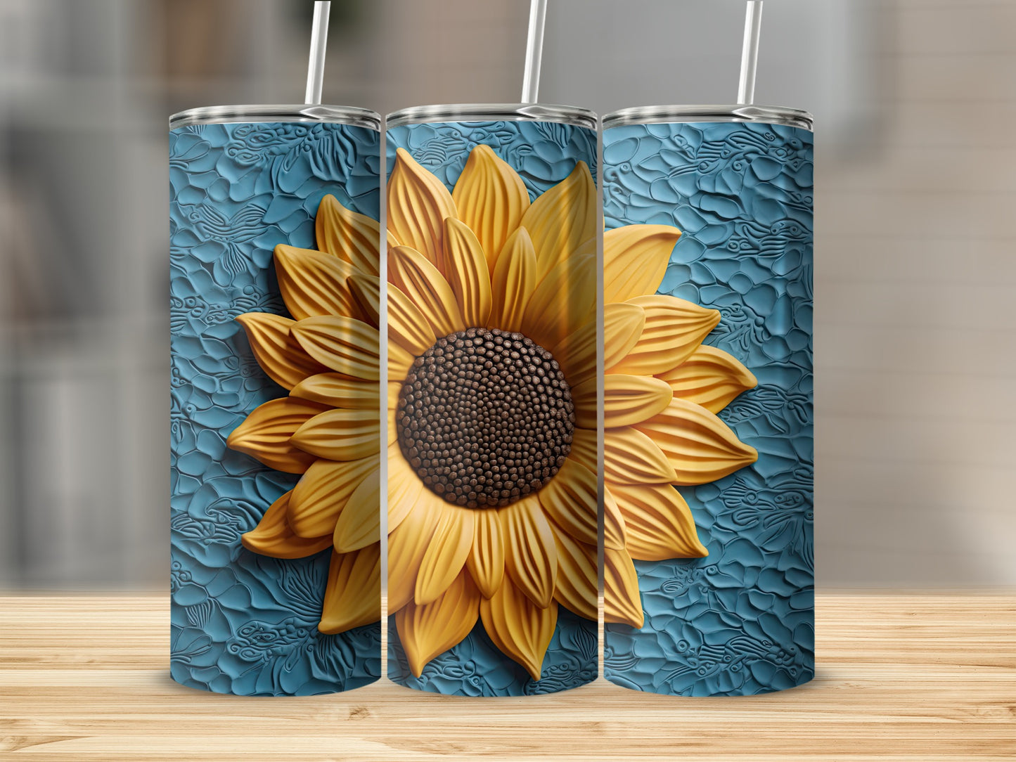 Three tumblers with a realistic sunflower design and textured blue background.