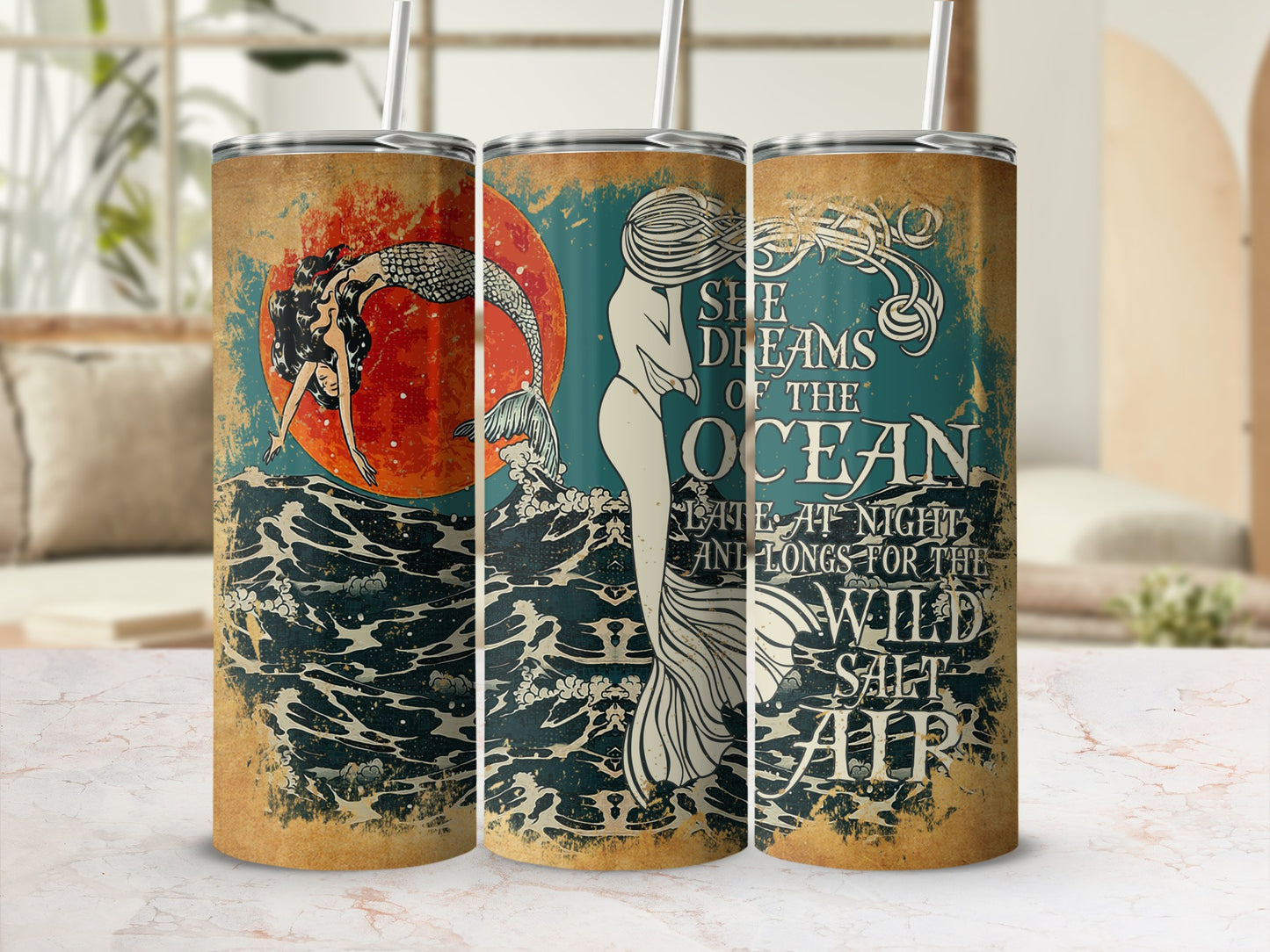 Tumbler with mermaid, ocean waves, and text "She dreams of the ocean."