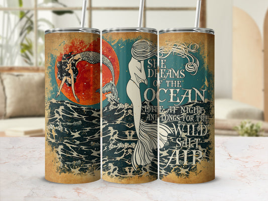 Tumbler with mermaid, ocean waves, and text "She dreams of the ocean."