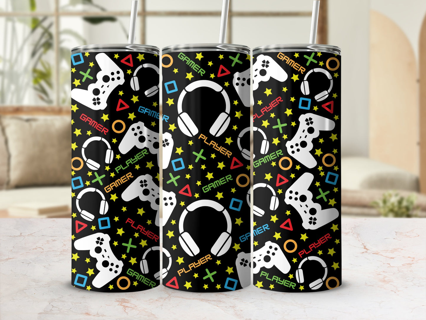 Black tumbler with white gamer, player, controller, and headphone icons.