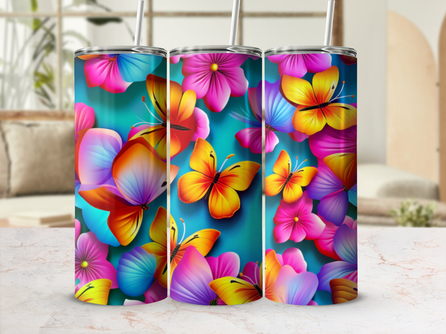 Three tumblers with colorful butterflies and floral designs.