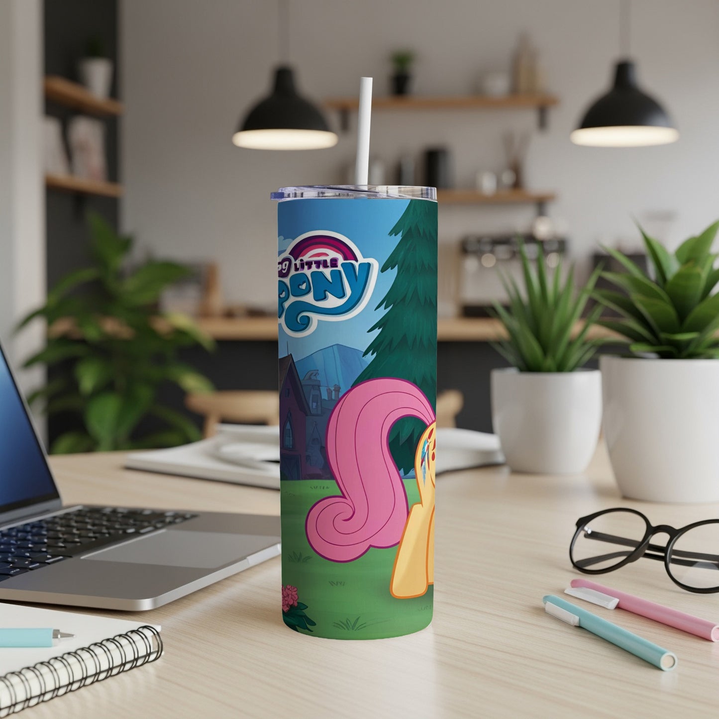 My Little Pony tumbler with character Rainbow Dash on a desk.