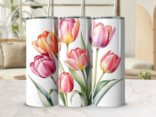Three tumblers with pink and orange tulips and green leaves.