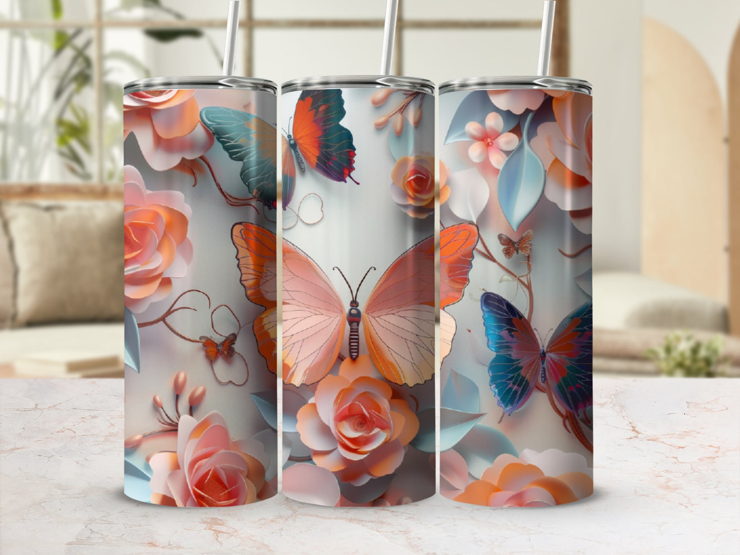 Three tumblers with floral and butterfly designs, featuring a large pink butterfly.