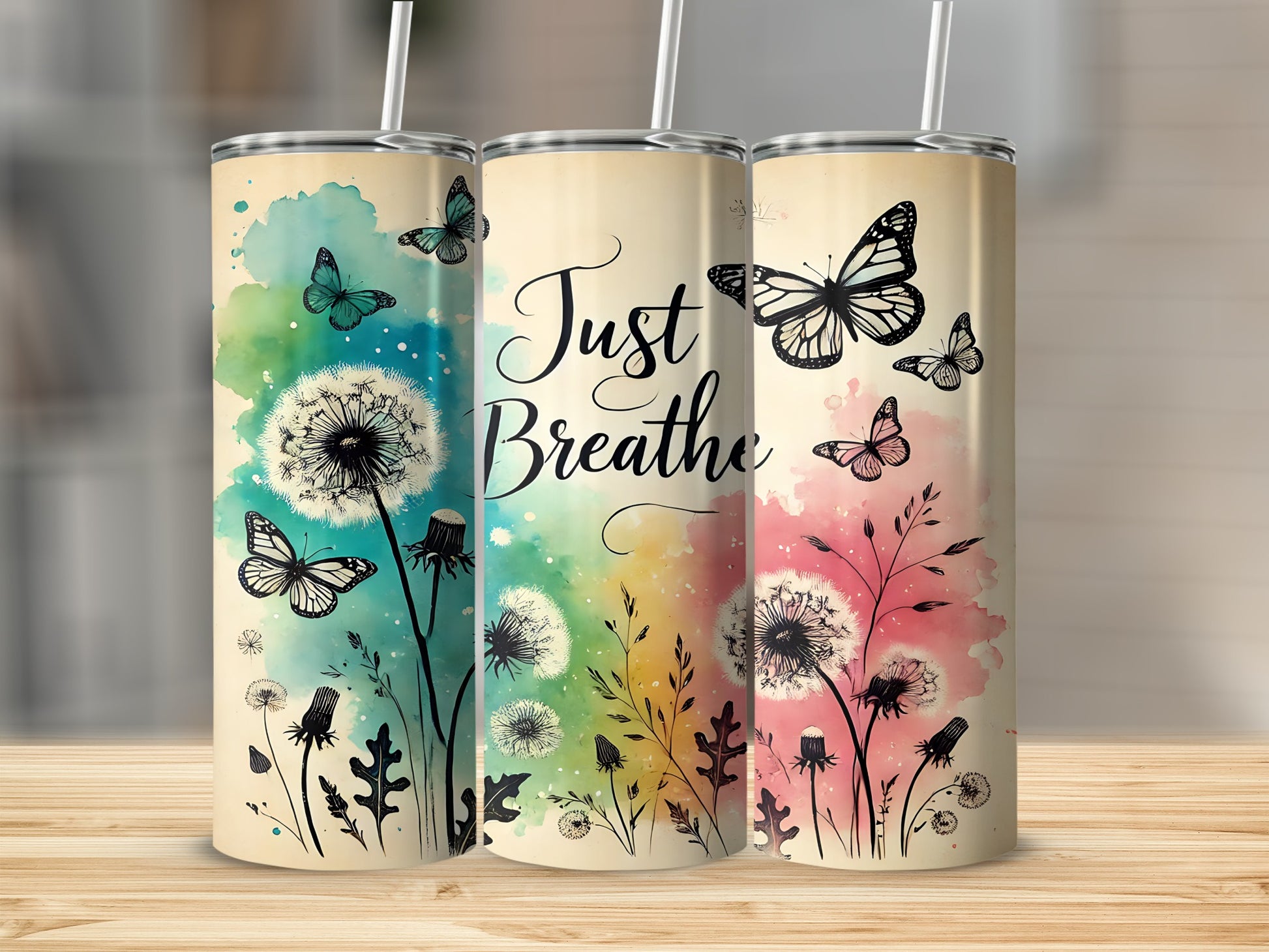 Three tumblers with dandelion and butterfly design, "Just Breathe" text.