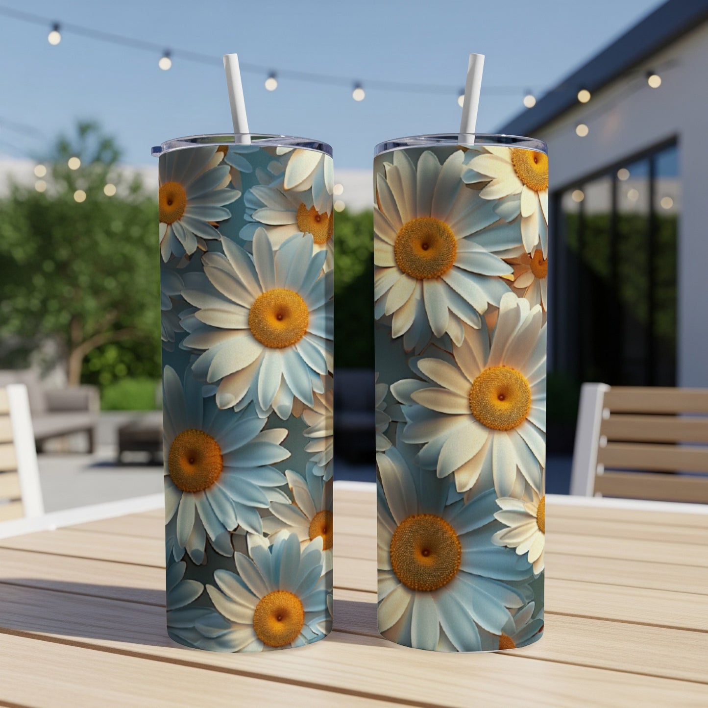 Two tumblers with a blue and white daisy floral pattern.