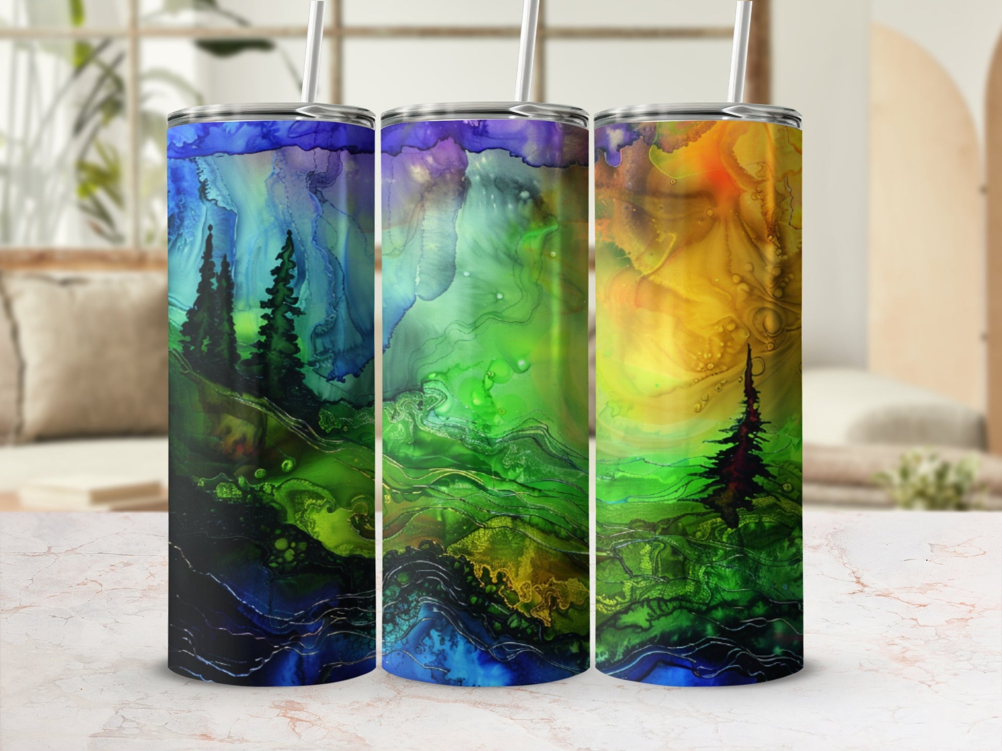 Three tumblers with abstract, watercolor-like landscape designs.