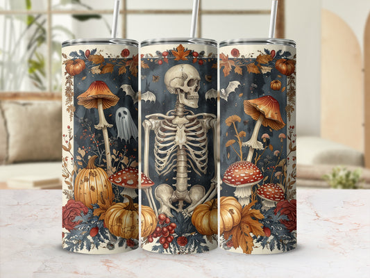 Three tumblers with skeleton, pumpkins, mushrooms, bats, and ghost Halloween design.