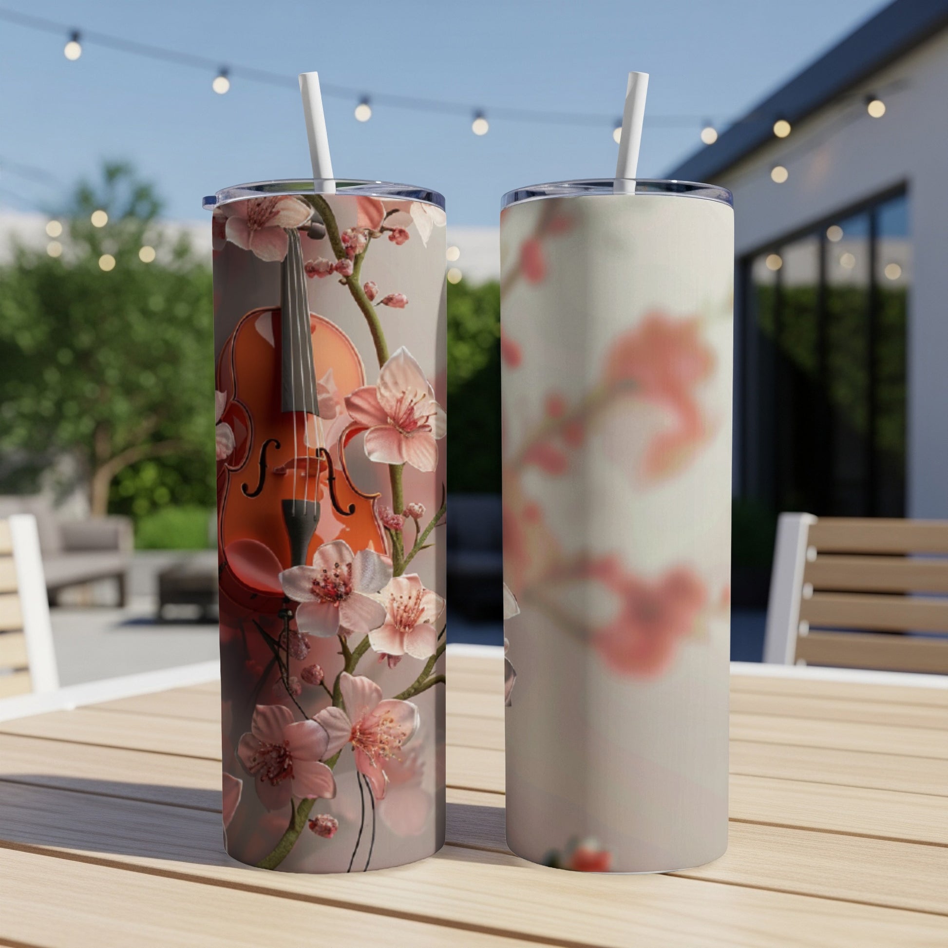 Two tumblers with a violin and cherry blossoms design.