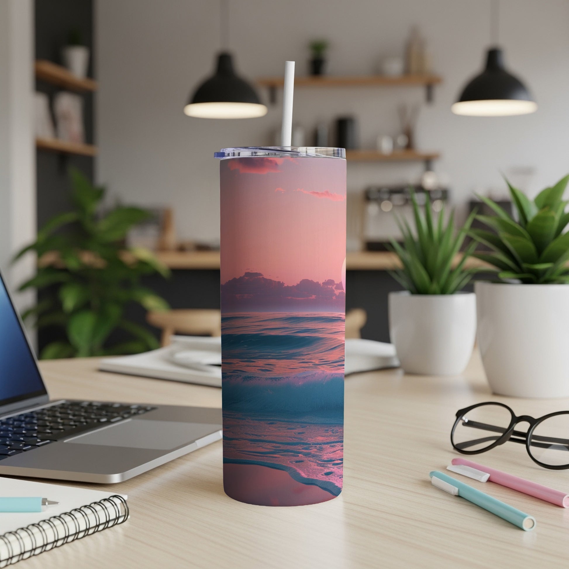 Ocean sunset waves on a tumbler with a straw.