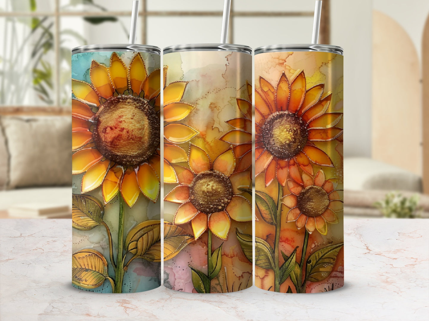 Three tumblers with sunflower designs in warm, watercolor-style hues.