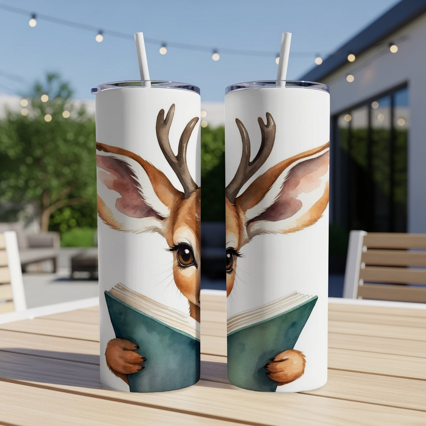 Deer reading a book on a tumbler, outdoors.
