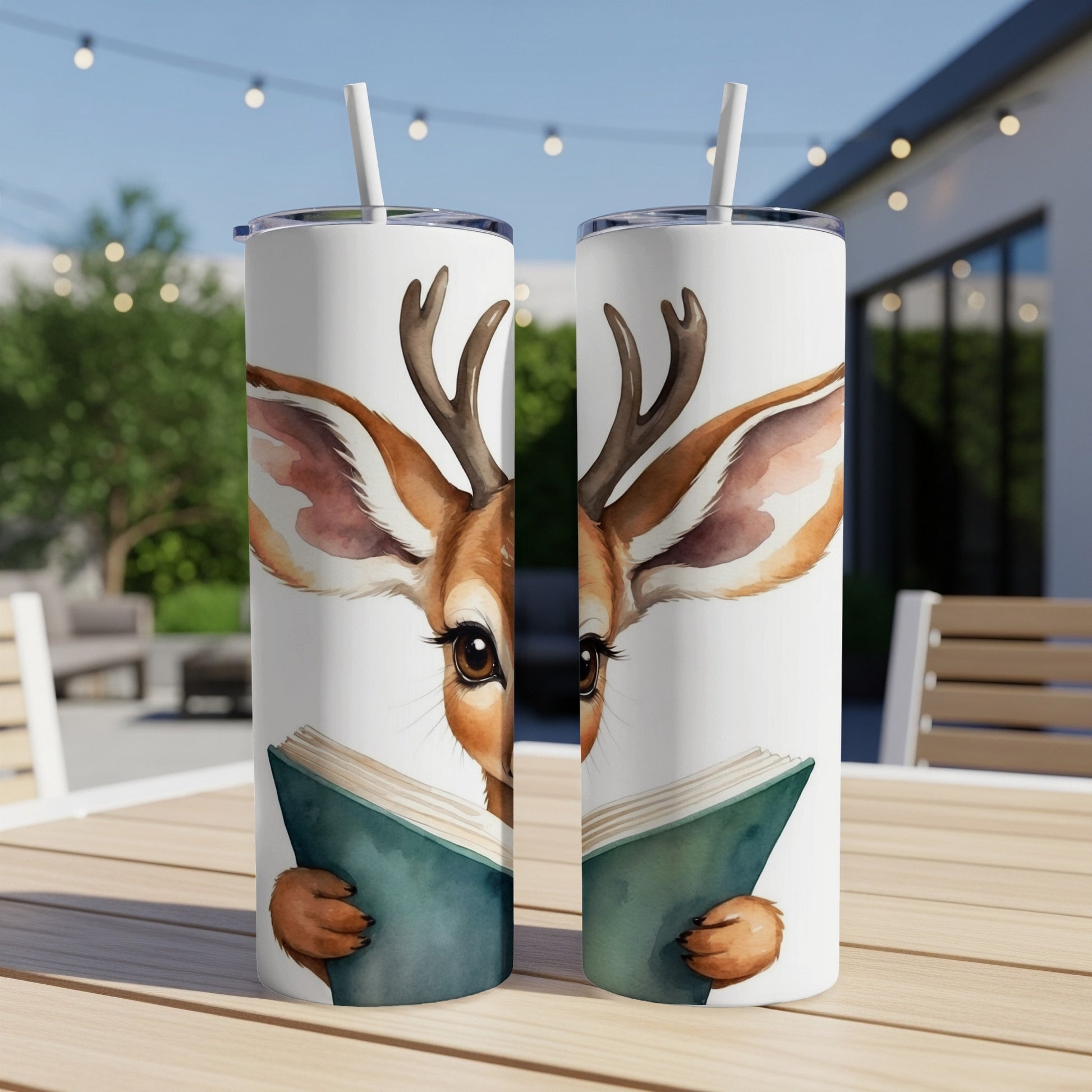 Deer reading a book on a tumbler, outdoors.