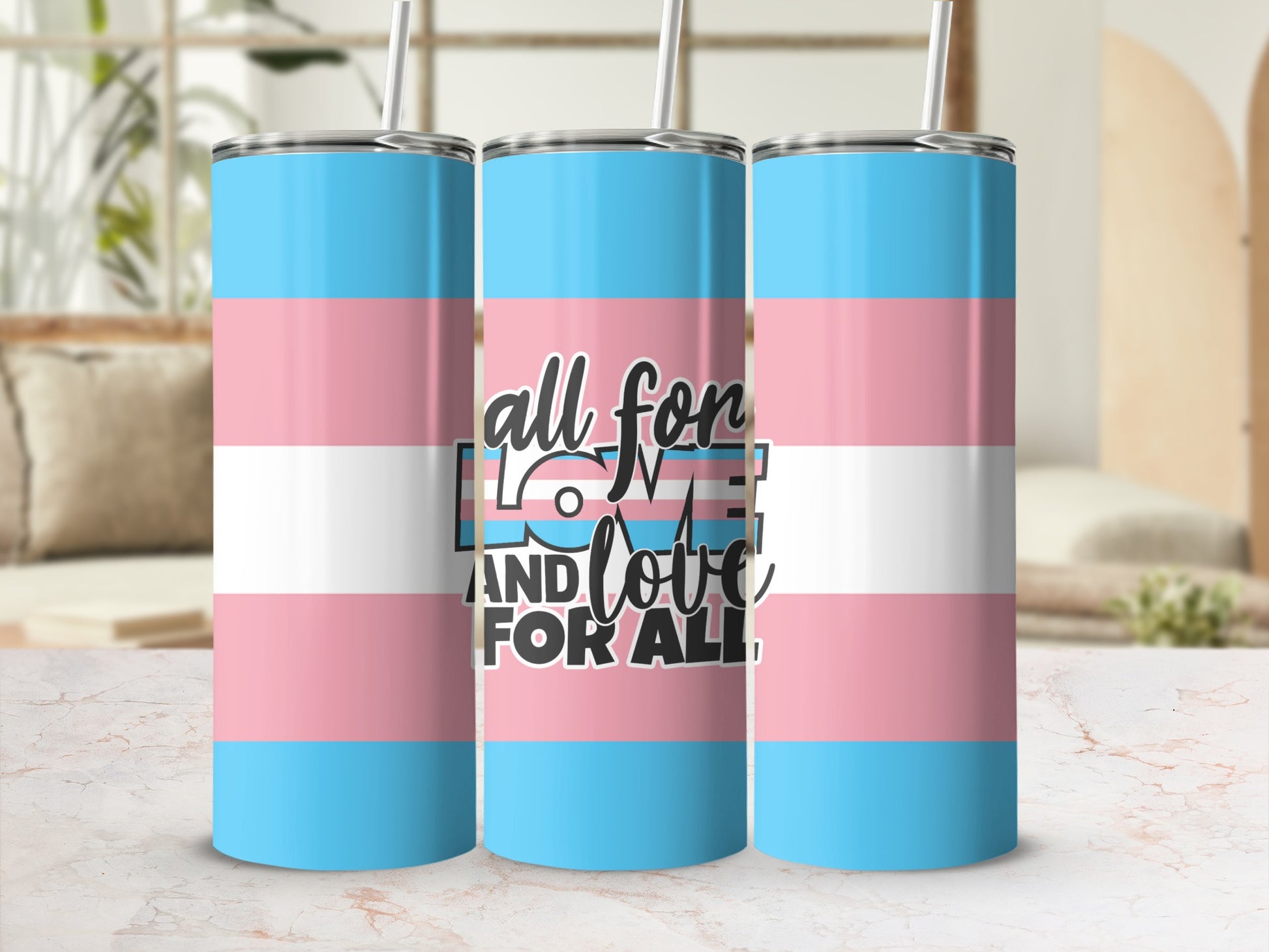 Three tumblers with transgender pride flag design and "love and for all" text.