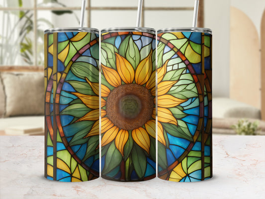 Three stained-glass tumblers with sunflower designs and straws.