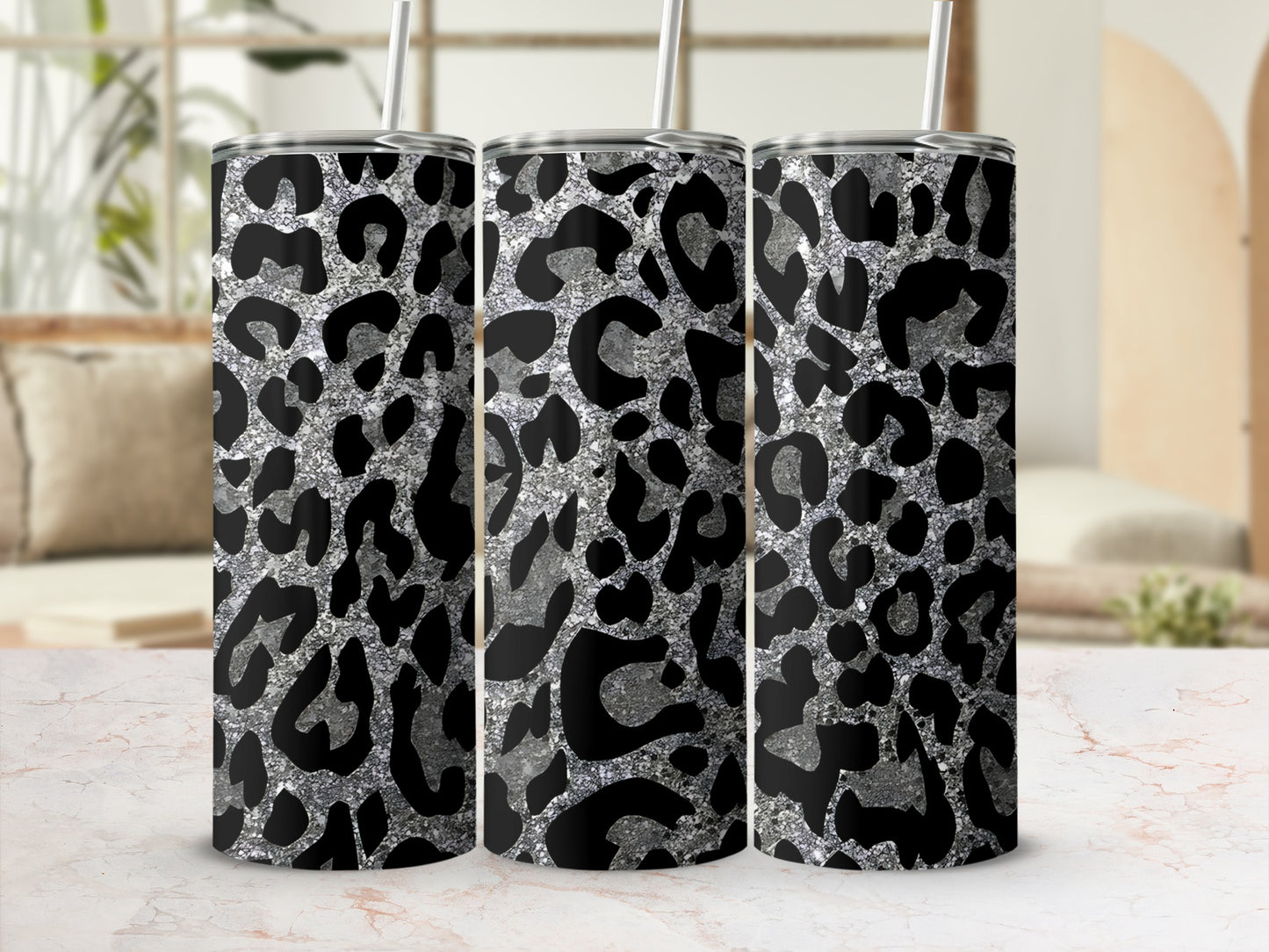Three tumblers with black and silver leopard print pattern.