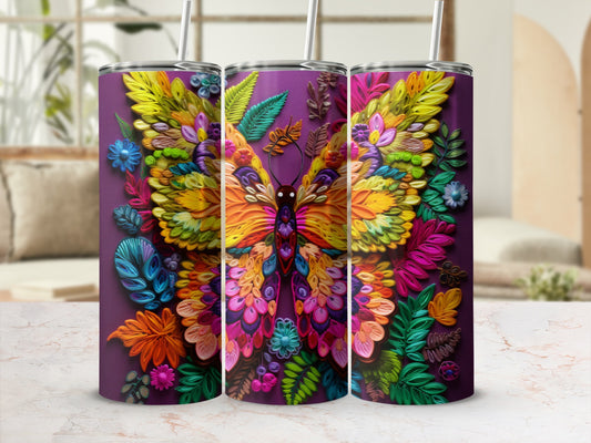 Butterfly art tumbler with colorful floral wings on a dark purple background.