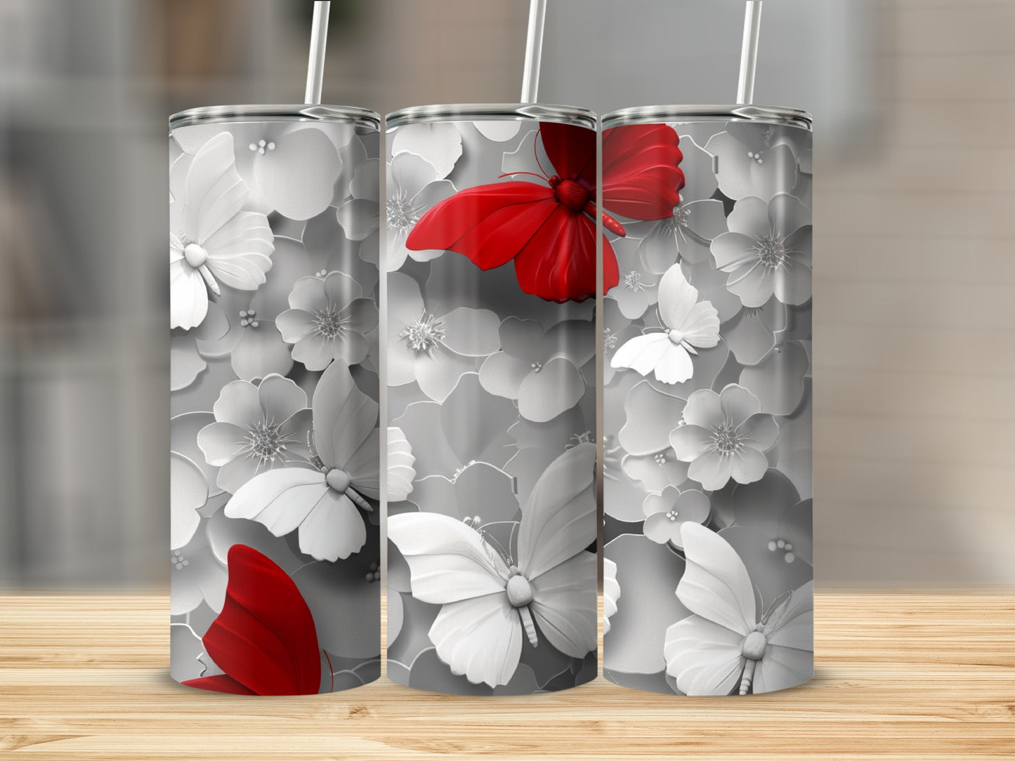 Three tumblers with a floral and red butterfly design.