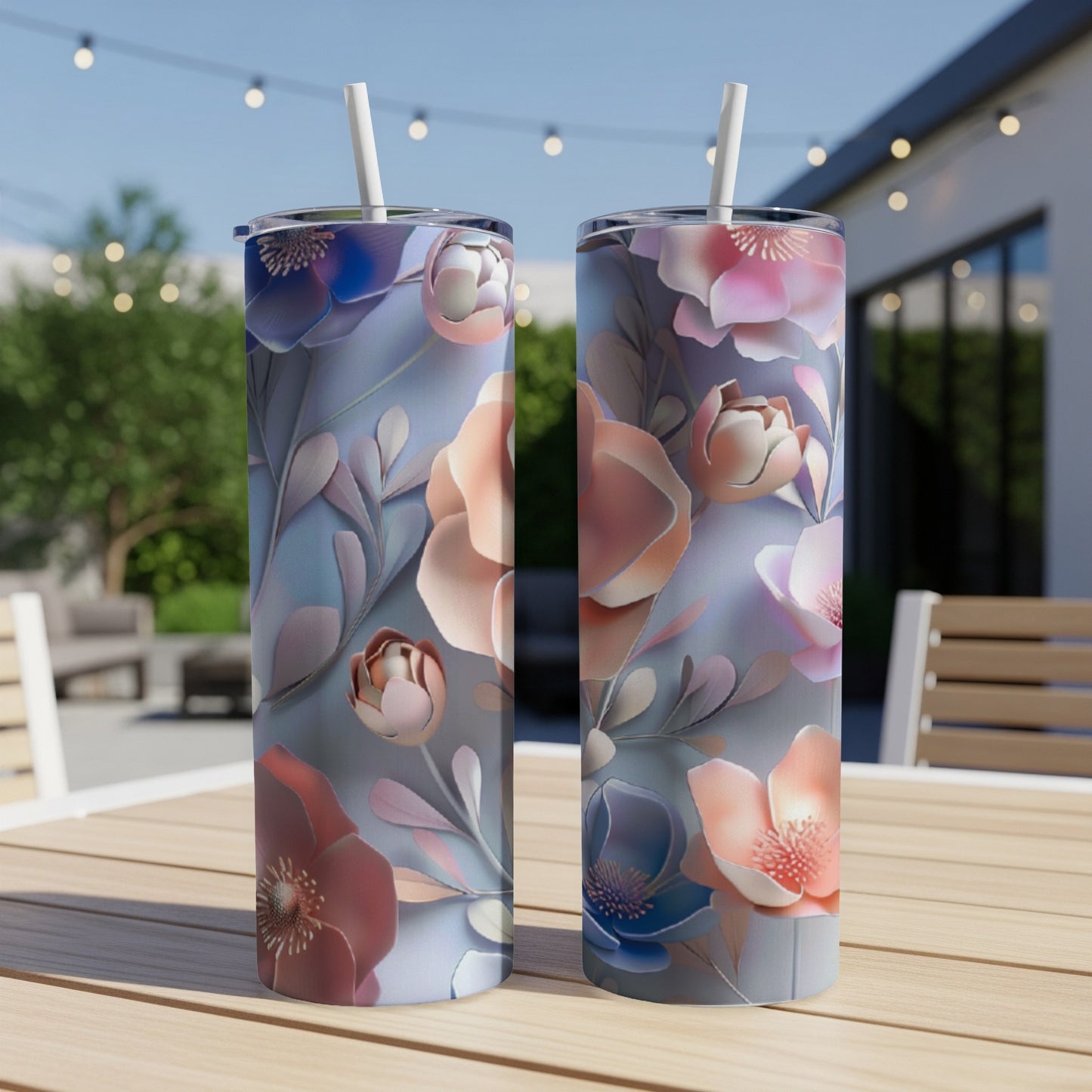 Two tumblers with a floral pattern sit on a wooden table.