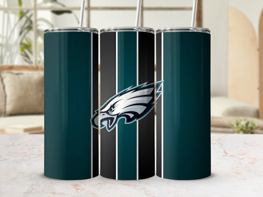 Philadelphia Eagles logo on a striped tumbler with a straw.