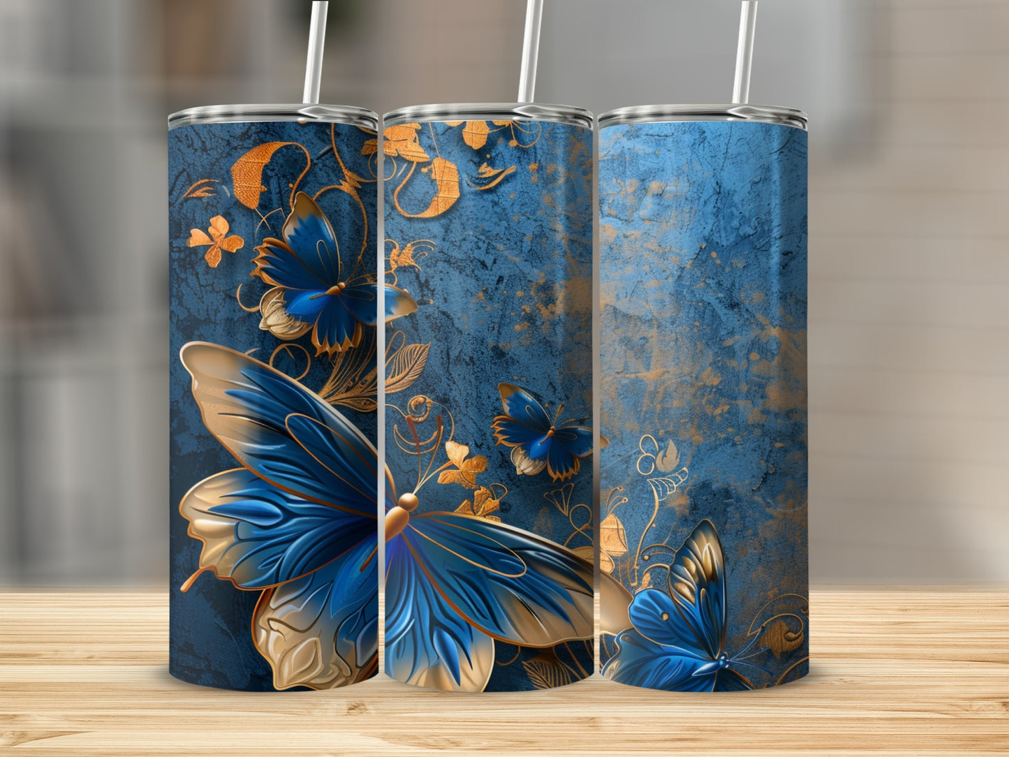 Blue and gold patterned tumblers with butterflies.