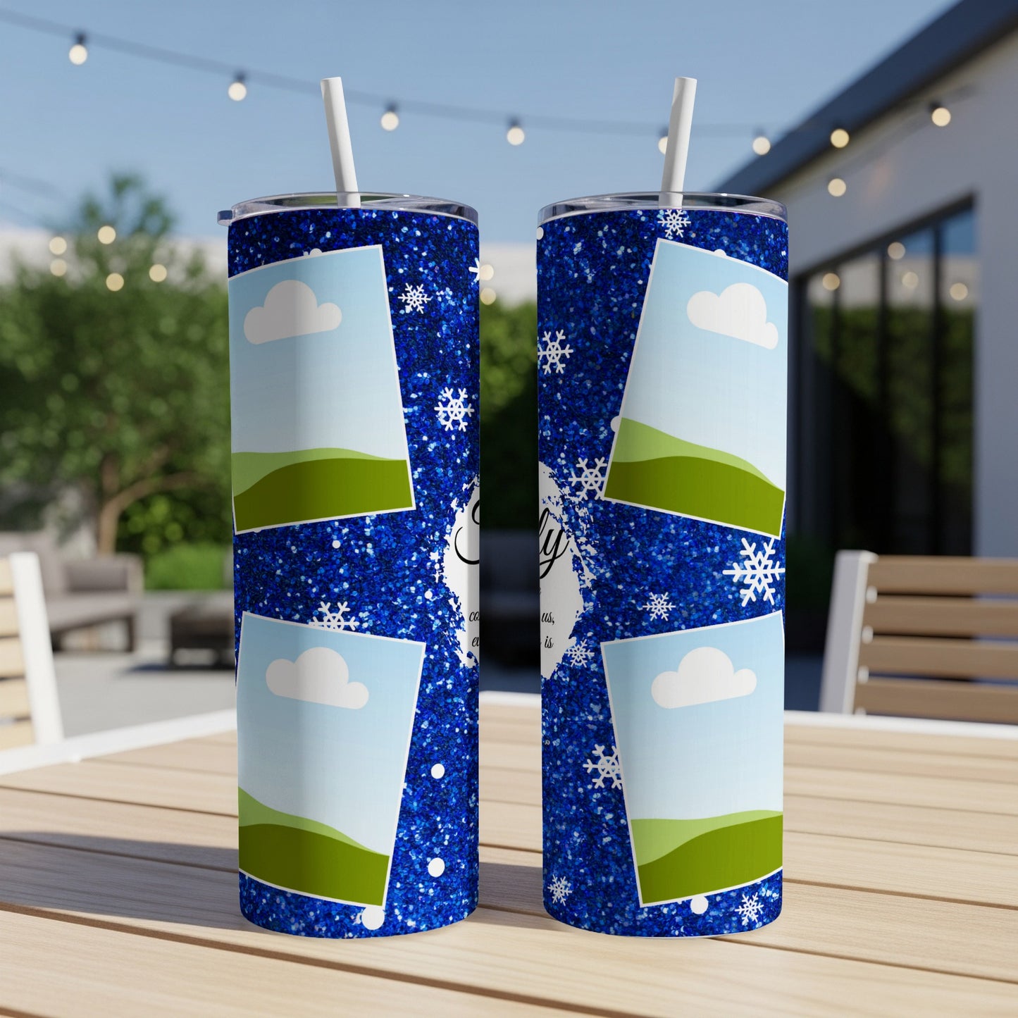 Two blue glitter tumblers with snowflake and cloud design and photo frames.