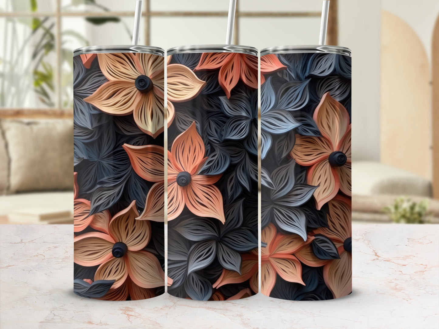 Three tumblers with a repeating floral pattern in orange, beige, and gray.