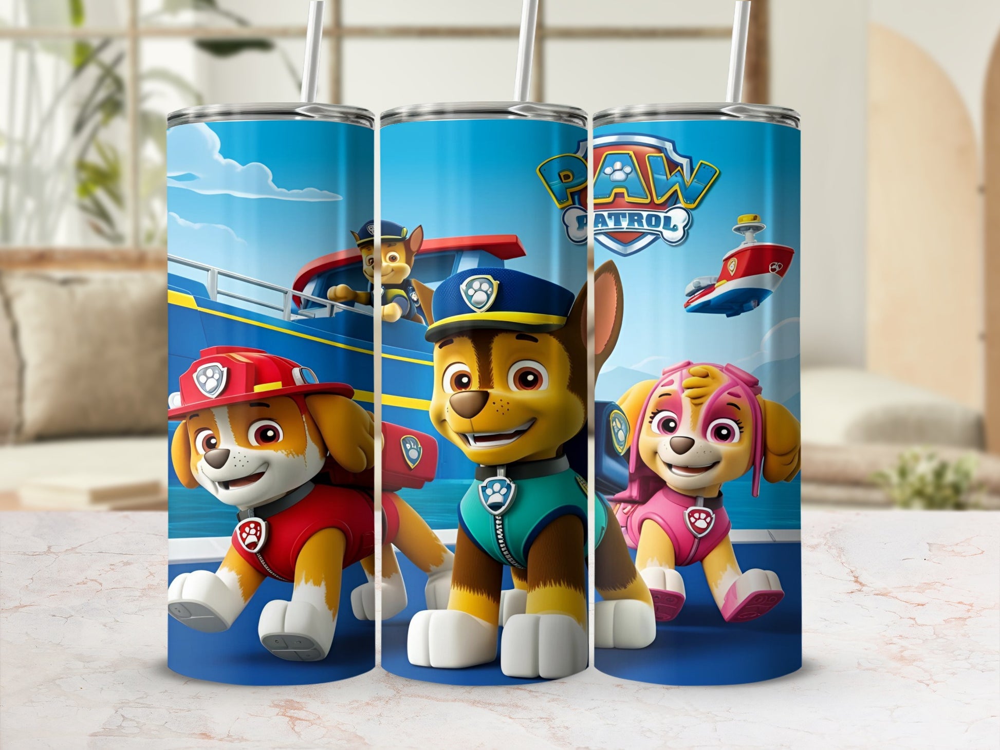 Chase, Marshall, and Skye from Paw Patrol on a blue tumbler.