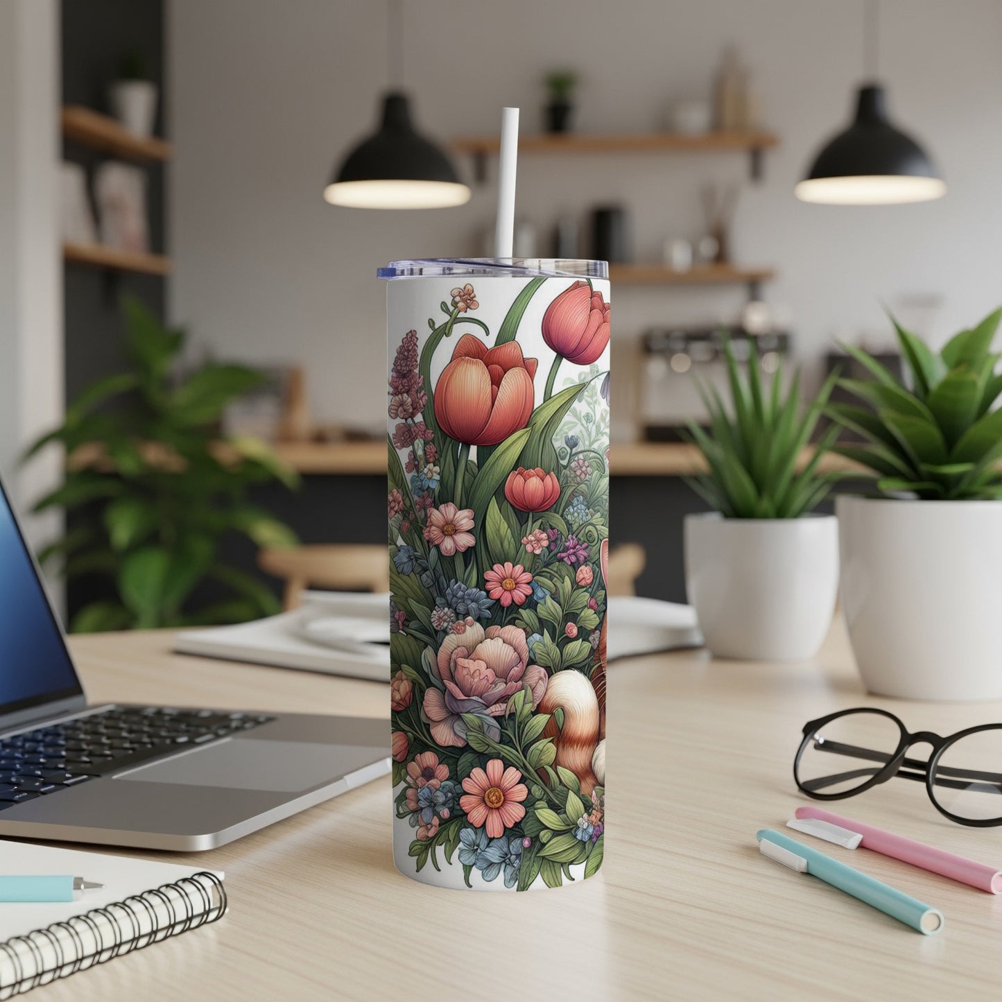 White tumbler with a floral pattern featuring tulips and other flowers.