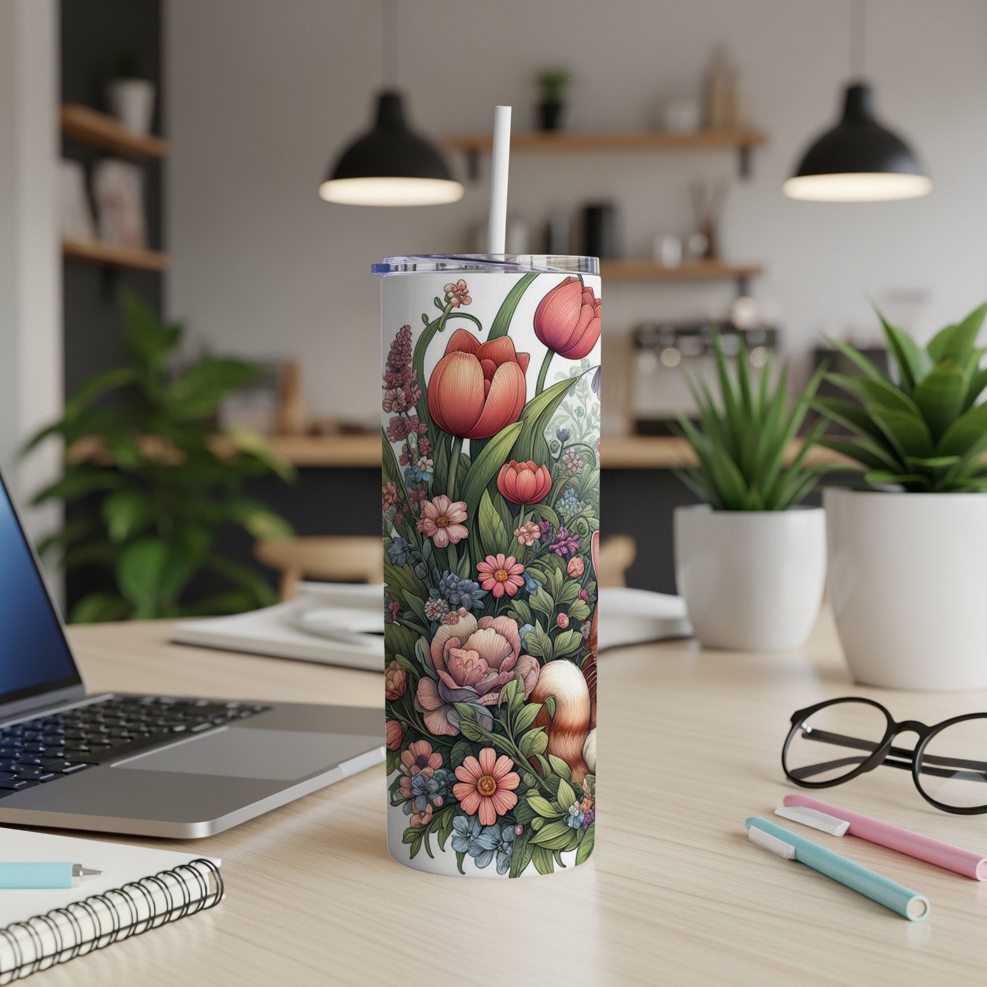 White tumbler with a floral pattern featuring tulips and other flowers.