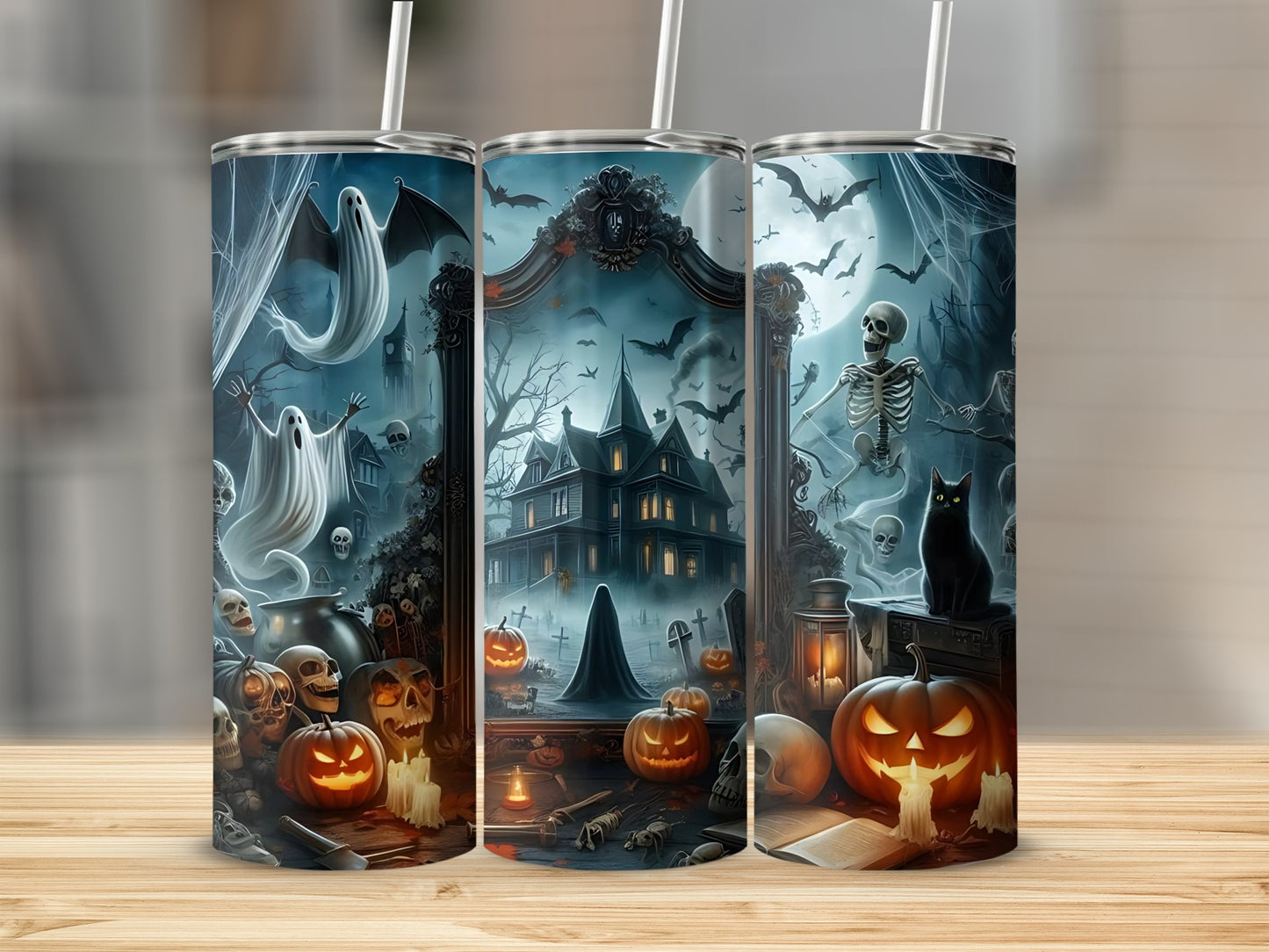 Three tumblers with Halloween scenes featuring ghosts, pumpkins, skeletons, and a haunted house.