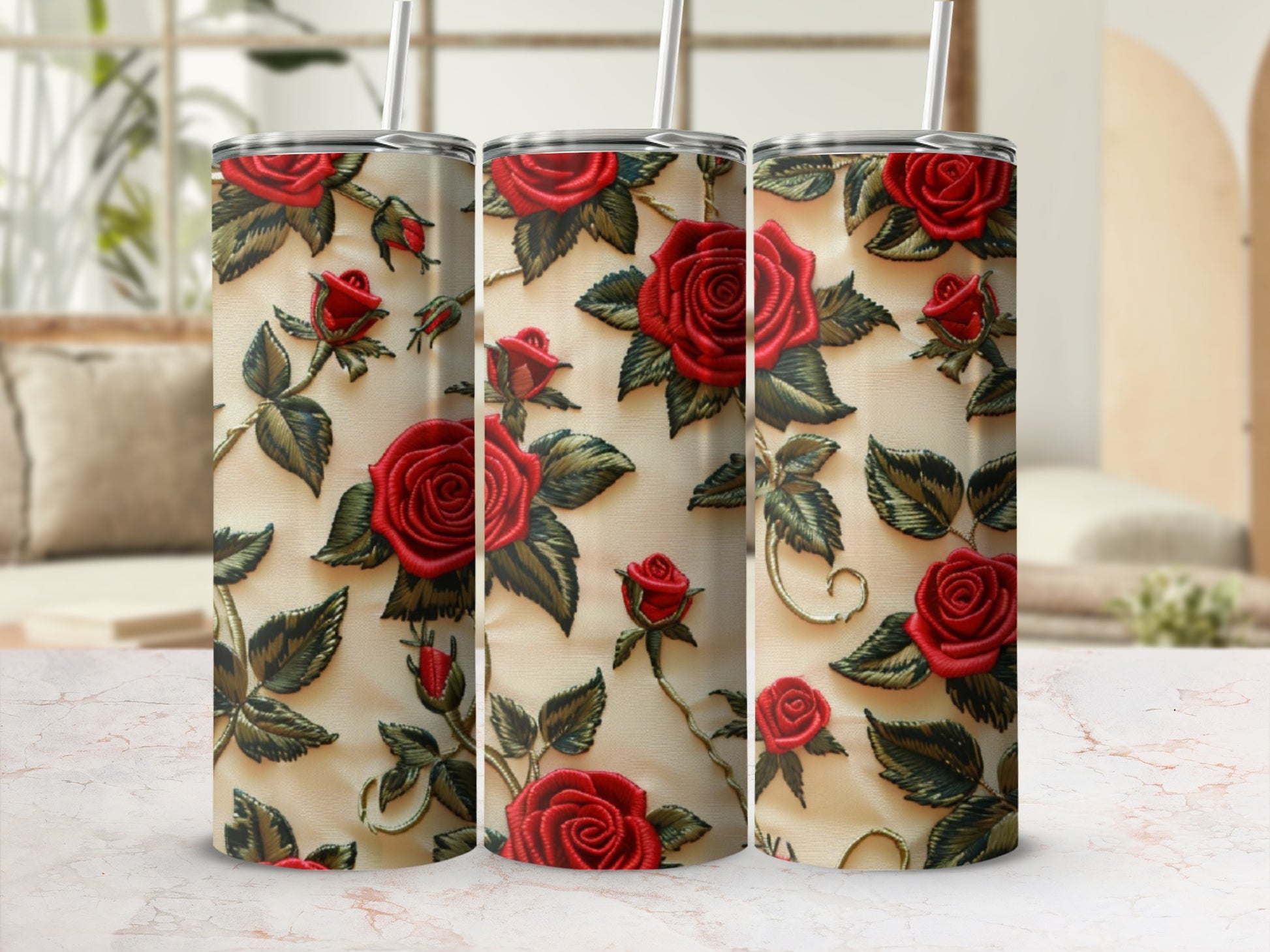 Three tumblers with a textured red rose and green leaf pattern.