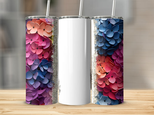 Three tumblers with floral designs and a blank white tumbler.