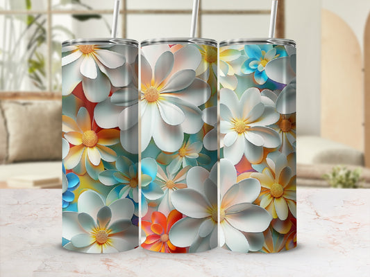 Three tumblers with a repeating floral pattern of white, yellow, and blue flowers.