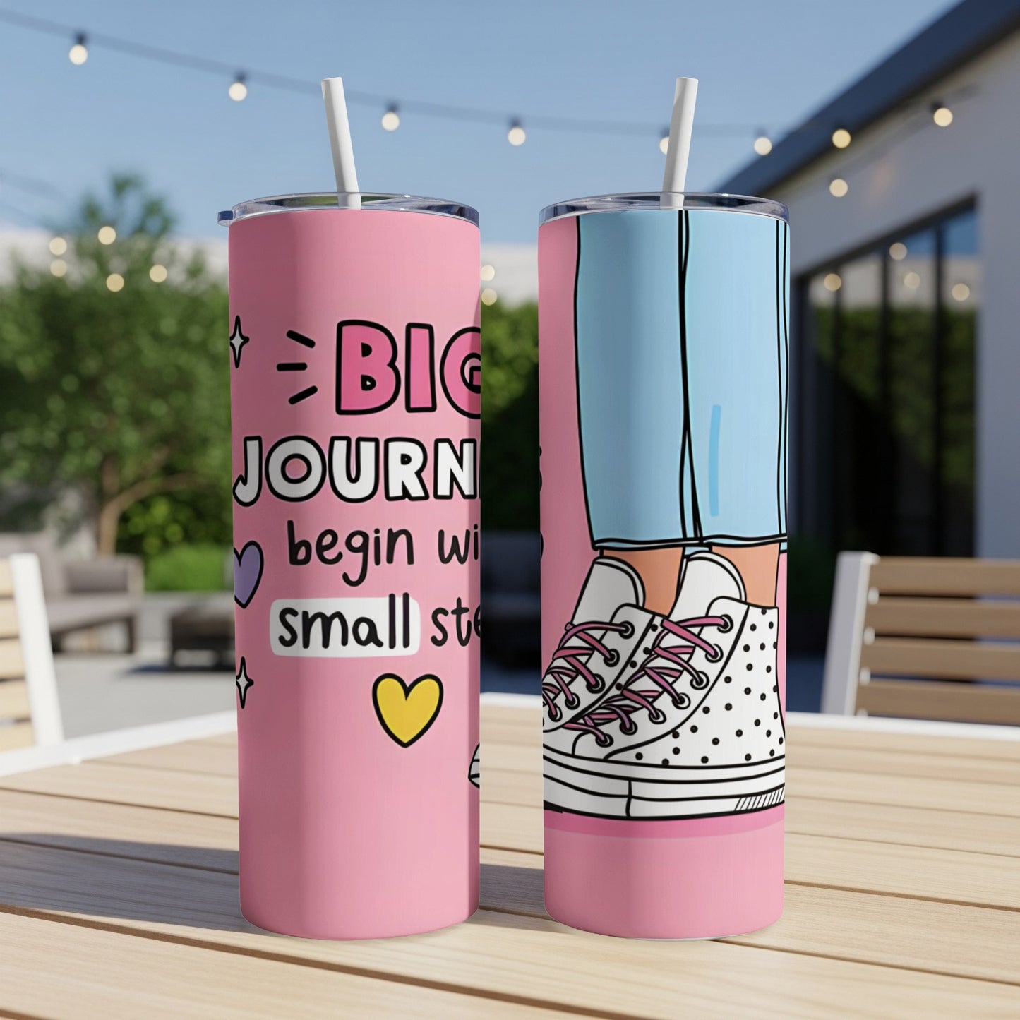Pink tumbler with "Big Journeys Begin with Small Steps" text and stylish sneakers.