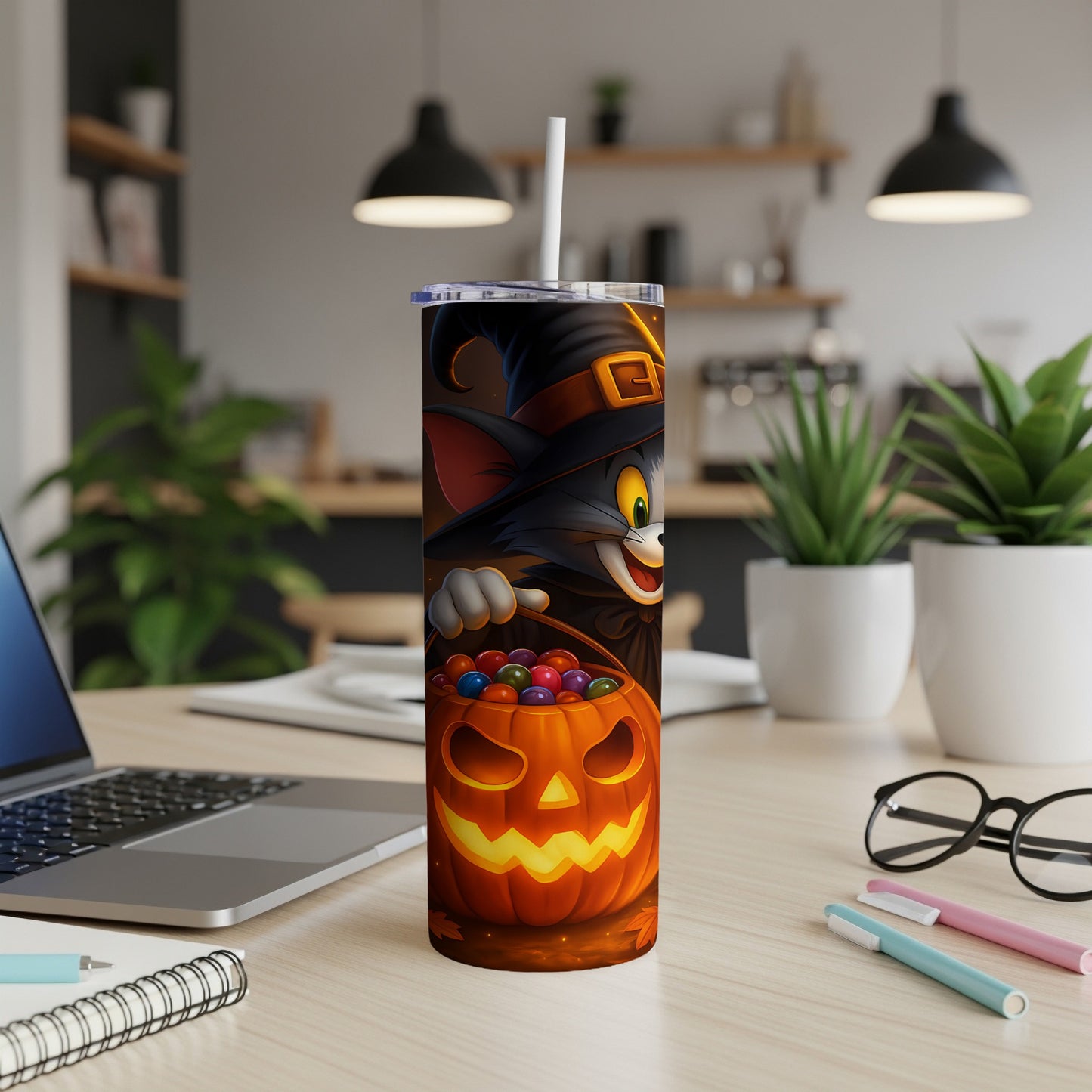 Halloween tumbler with Tom the cat as a witch holding a pumpkin filled with candy.
