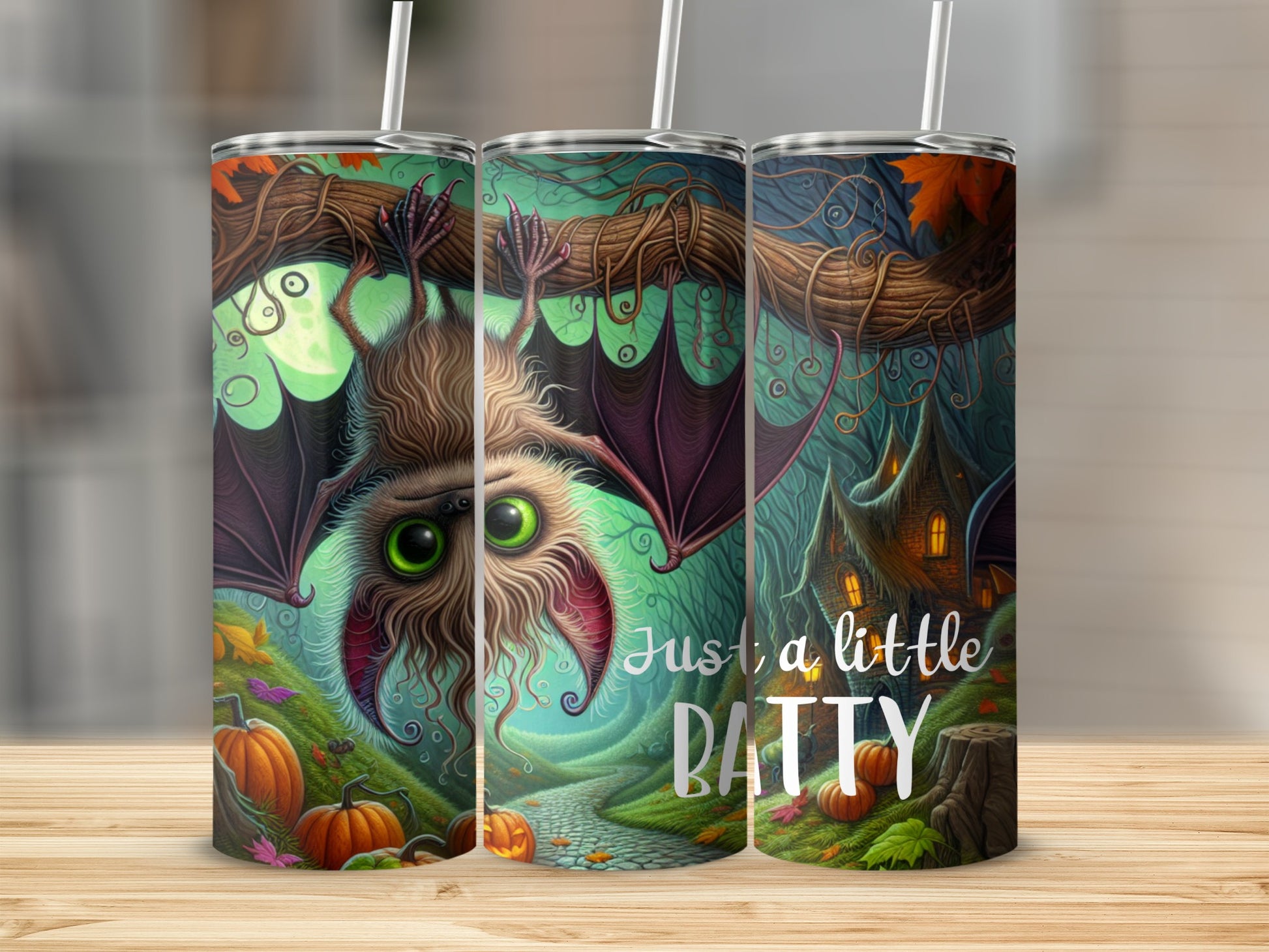 Tumbler with a bat, pumpkins, and a spooky house, reads "Just a little BATTY".