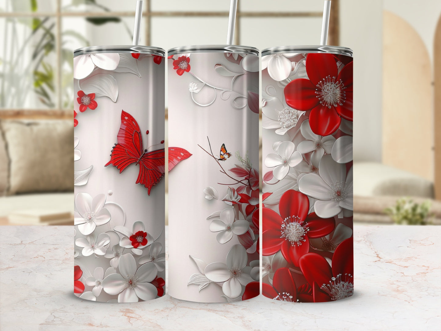 Three tumblers with red butterflies and floral designs.
