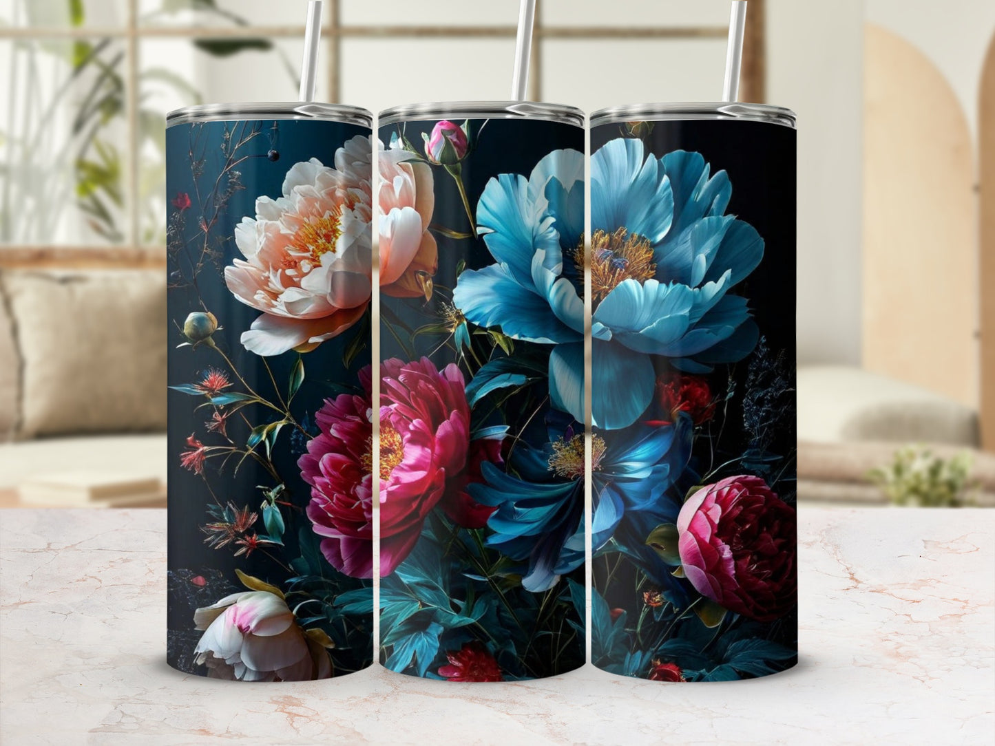 Three tumblers with vibrant blue, pink, and orange floral designs on a dark background.