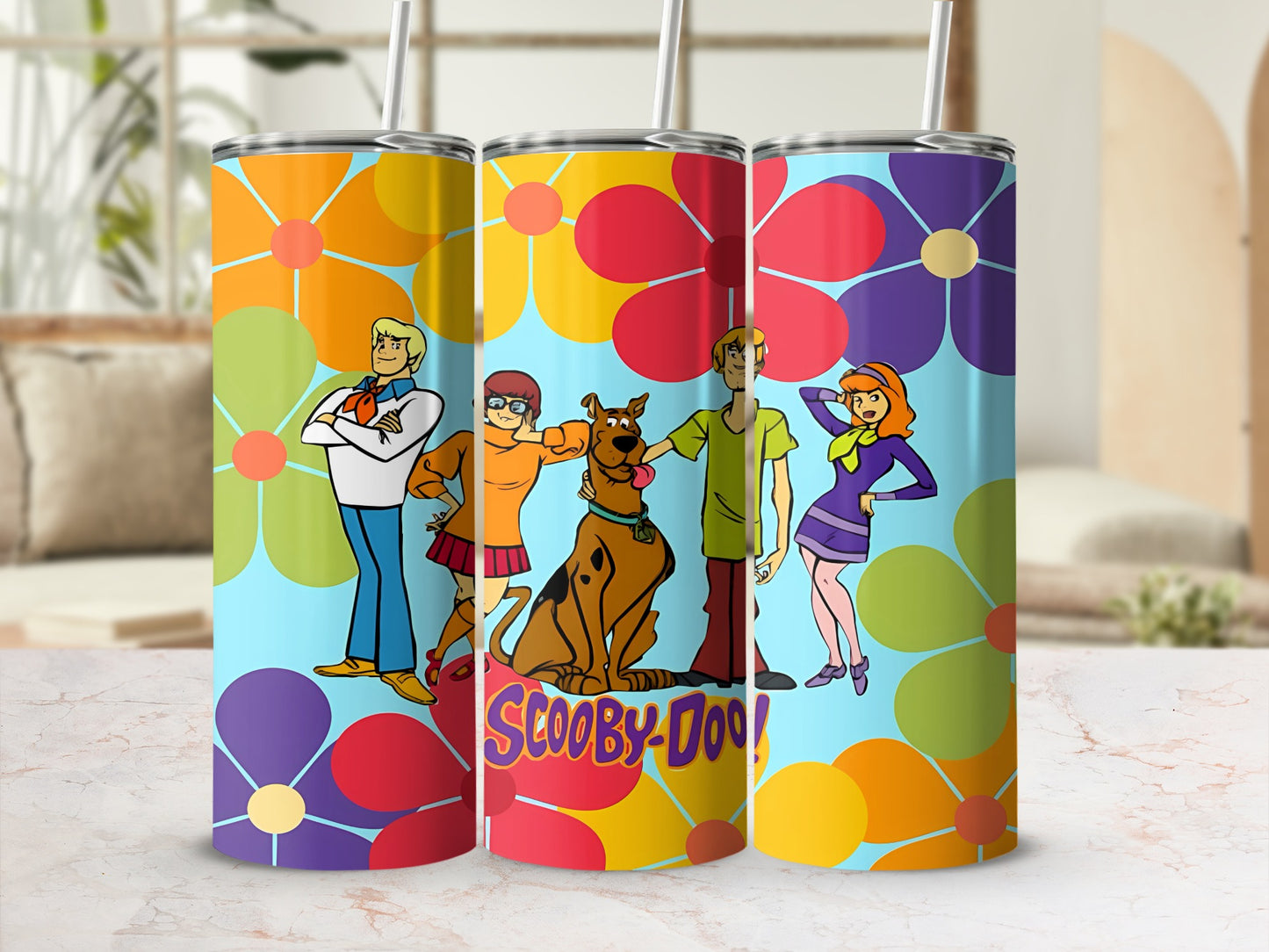 Scooby-Doo characters on a colorful floral tumbler.