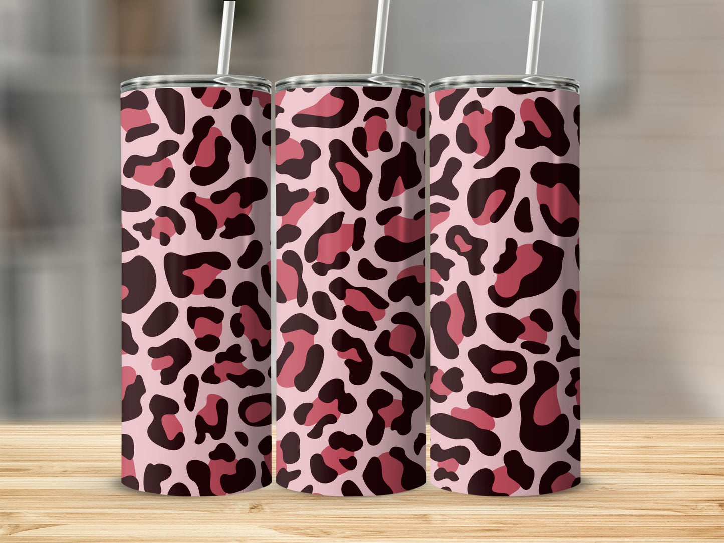 Three tumblers with pink and maroon leopard print pattern.