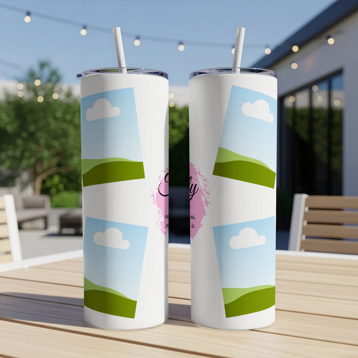 Two white tumblers with a sky and clouds pattern and script text.