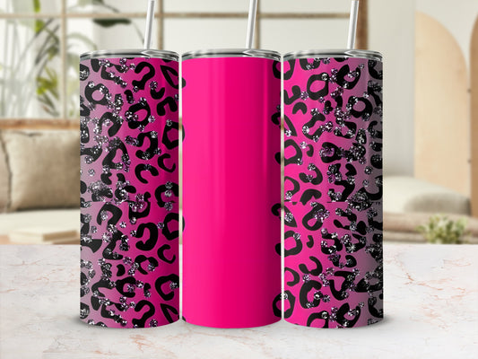 Pink tumbler with black and silver leopard print on a marble countertop.