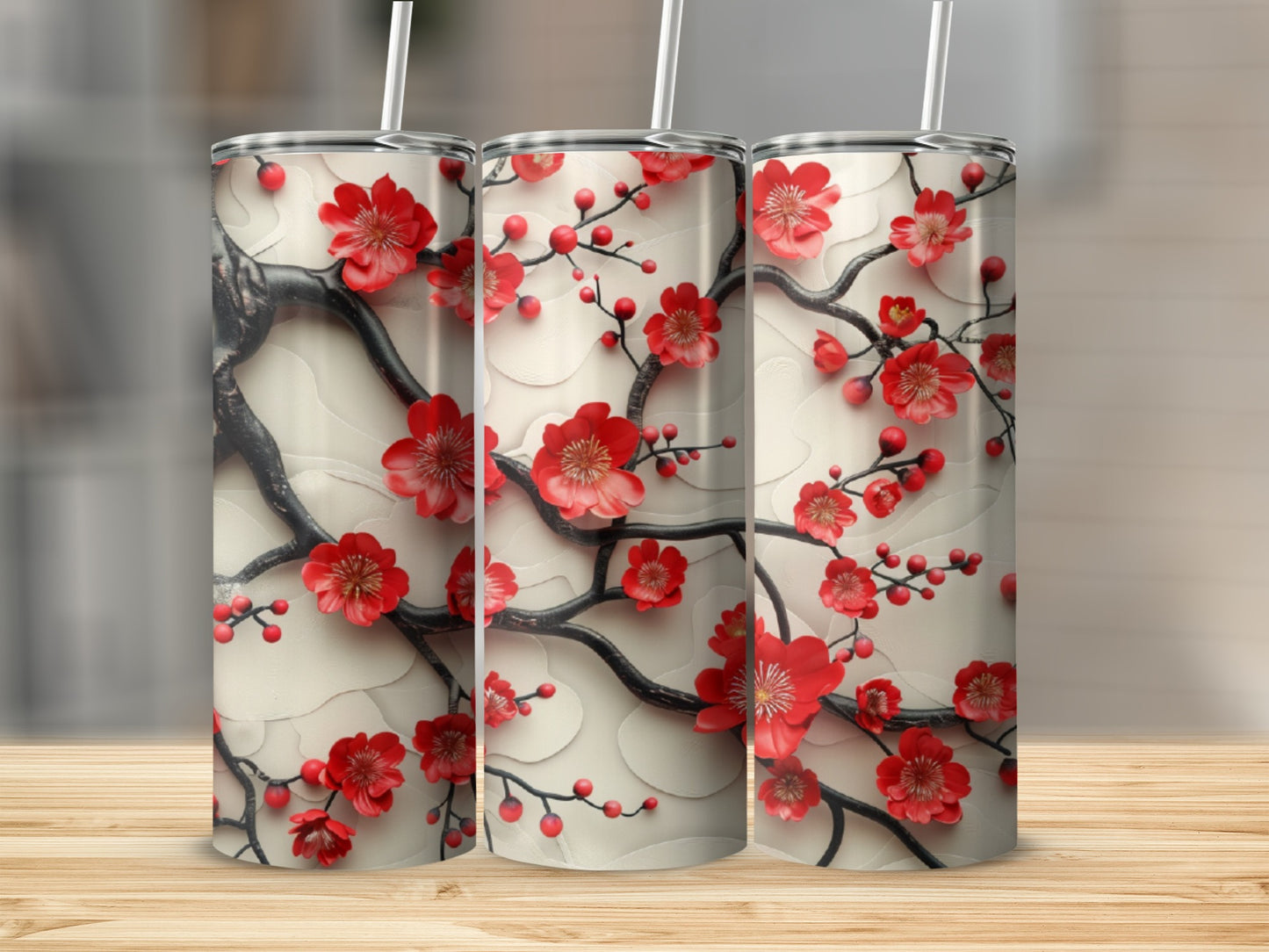 Three tumblers with red cherry blossoms and branches on a cream background.