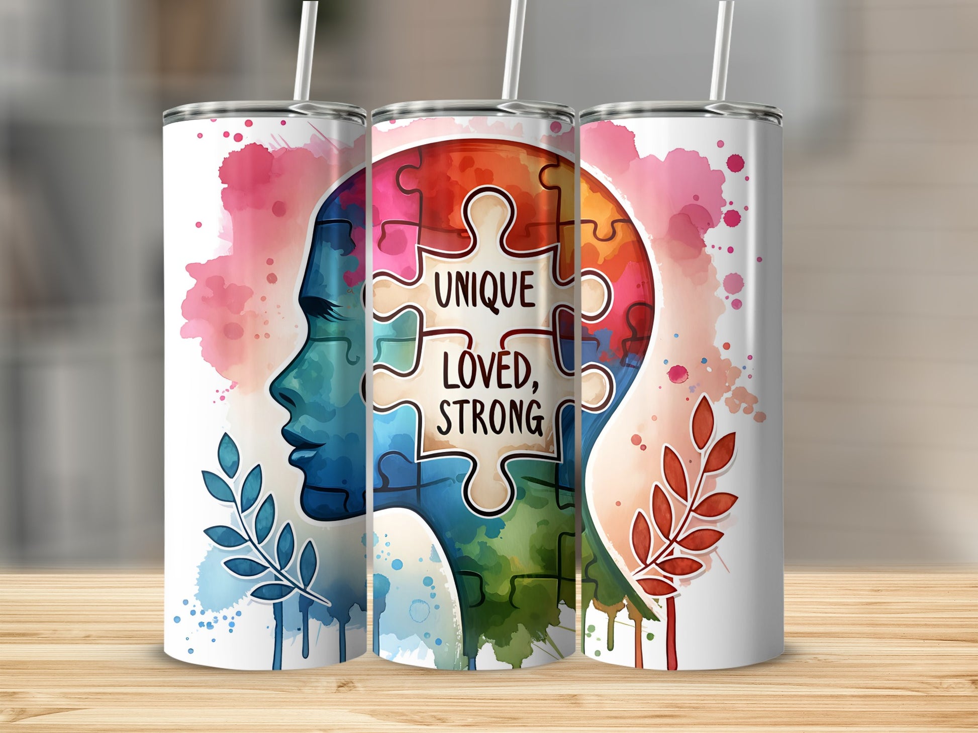 Tumbler with autism awareness puzzle piece head design and text.