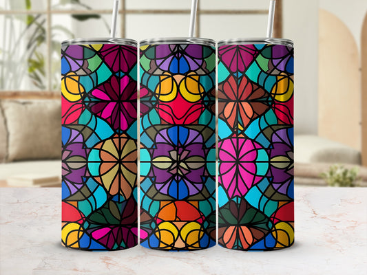 Three colorful stained glass pattern tumblers with straws.