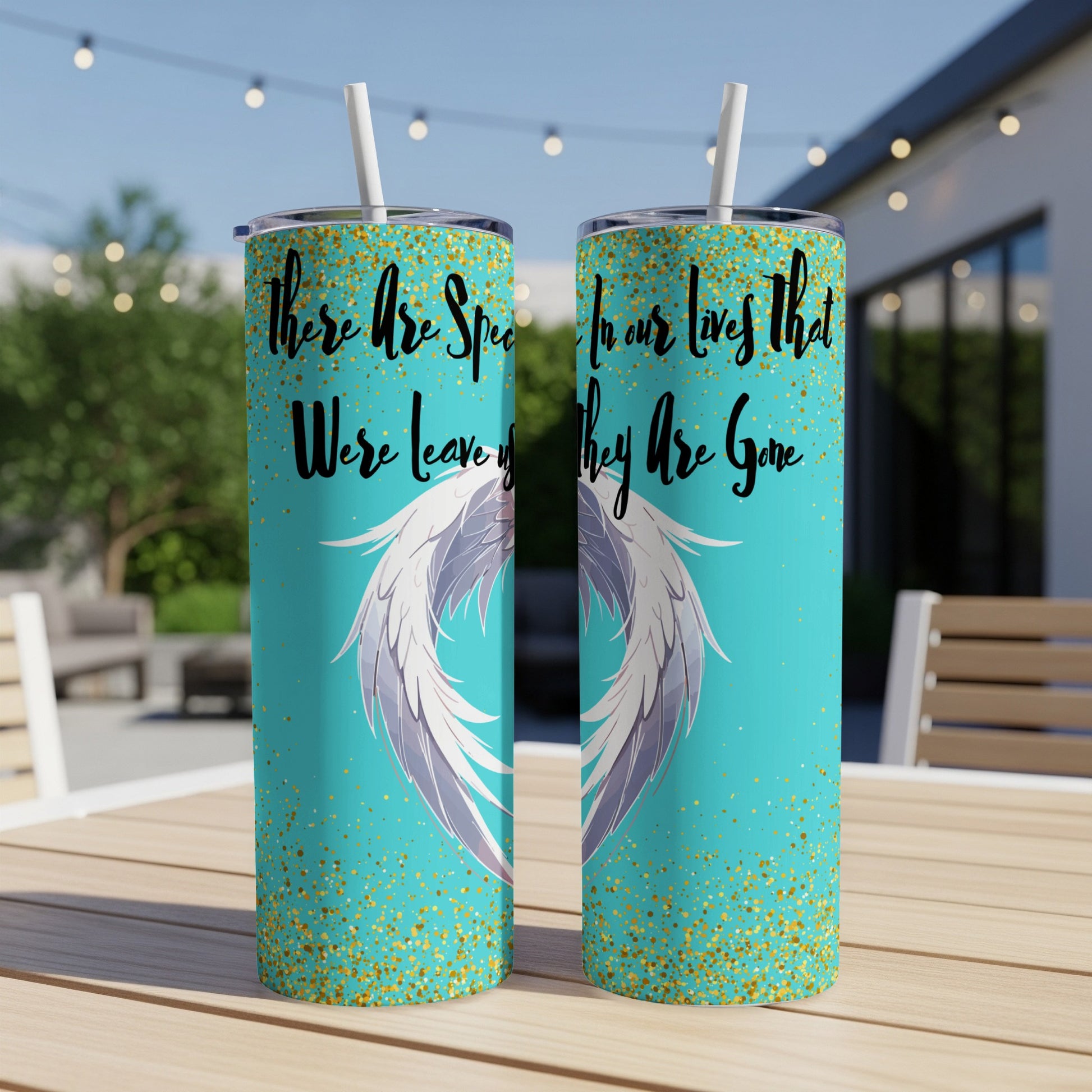 Two teal tumblers with angel wings, glitter, and memorial text.