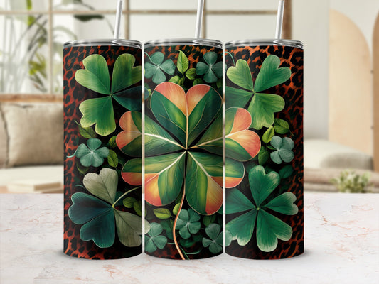 Three tumblers with clover and leopard print designs.